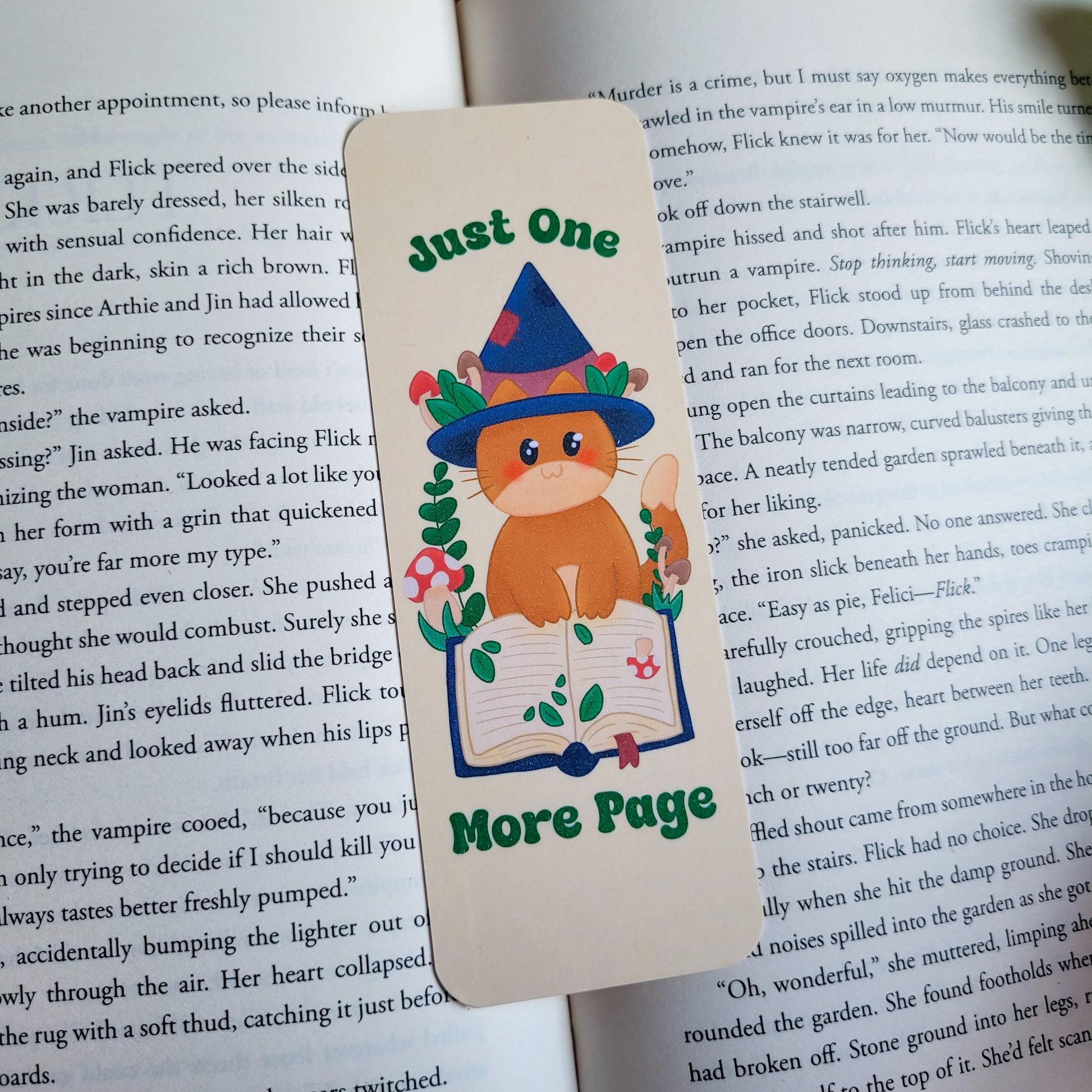Cute cat witch bookmark featuring the text "Just one more page"