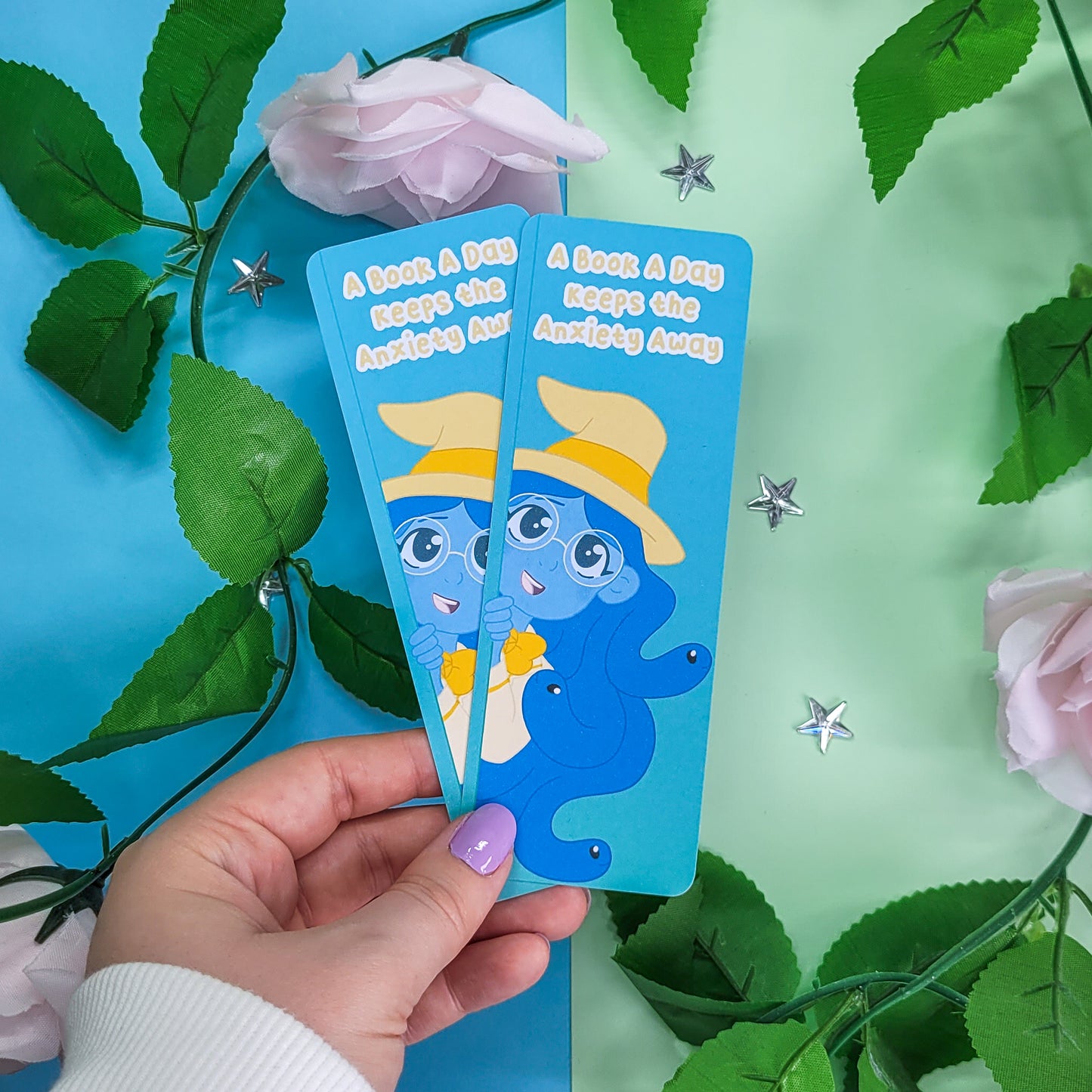 Cute witch bookmark featuring the phrase "a book a day keeps the anxiety away"