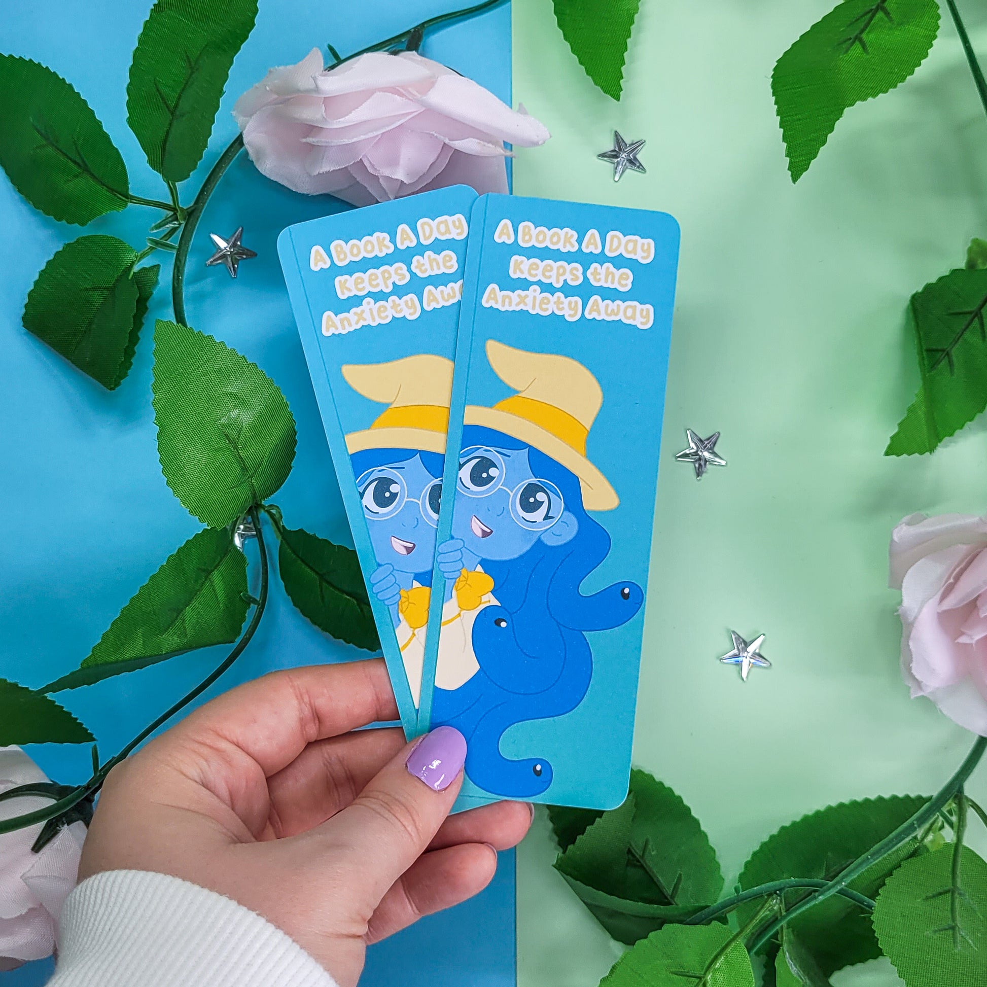 Cute witch bookmark featuring the phrase "a book a day keeps the anxiety away"