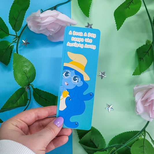 Cute witch bookmark featuring the phrase "a book a day keeps the anxiety away"