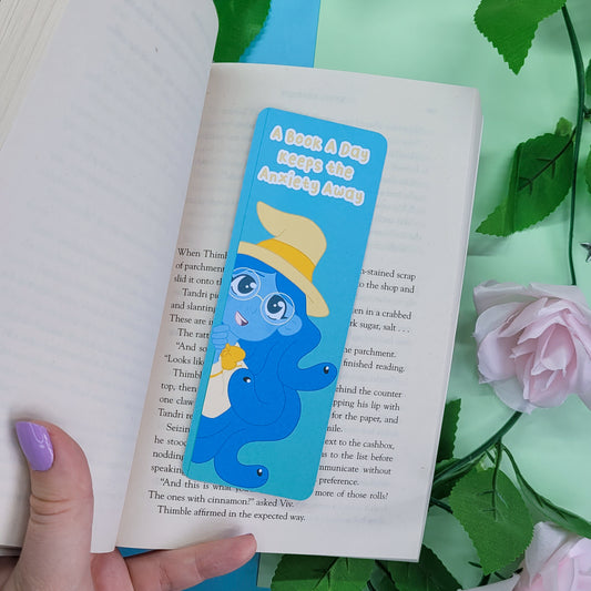 Cute witch bookmark featuring the phrase "a book a day keeps the anxiety away"