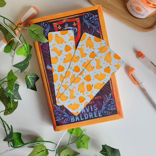 Cute Autumn bookmark featuring cats dressed as pumpkins