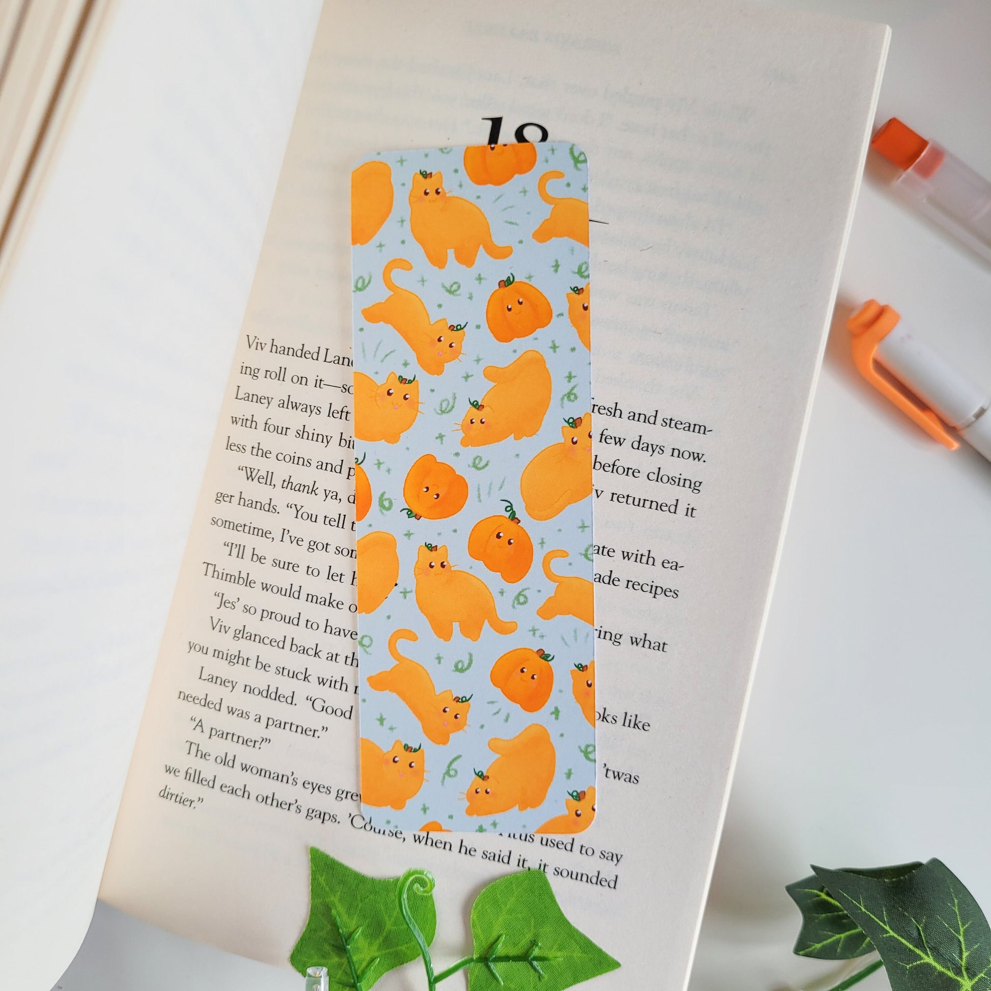 Cute Autumn bookmark featuring cats dressed as pumpkins