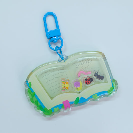 Bookish Bugs themed acryllic shaker keychain which is 3" size
